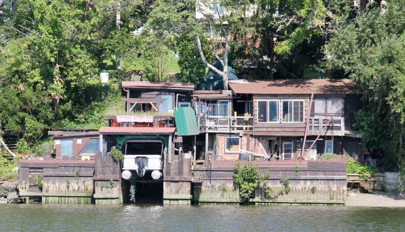 The owners of this habitation on the banks of the Hudson clearly want to immerse themselves - literally and figuratively -completely in the experience of their natural setting. Or, maybe they’ve tried it and are ready to move on. It can be yours. The phone number is on the For Sale sign. Notice the pontoon boat garage - a particularly nice touch.